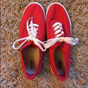 Red canvas shoes with white laces